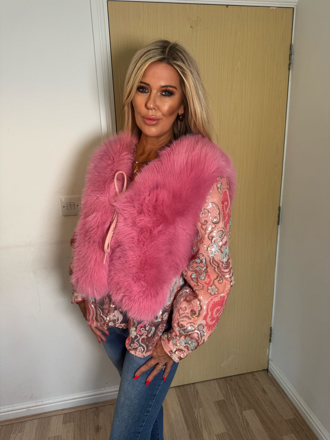 Pink faux fur gillet with sequin sleeves